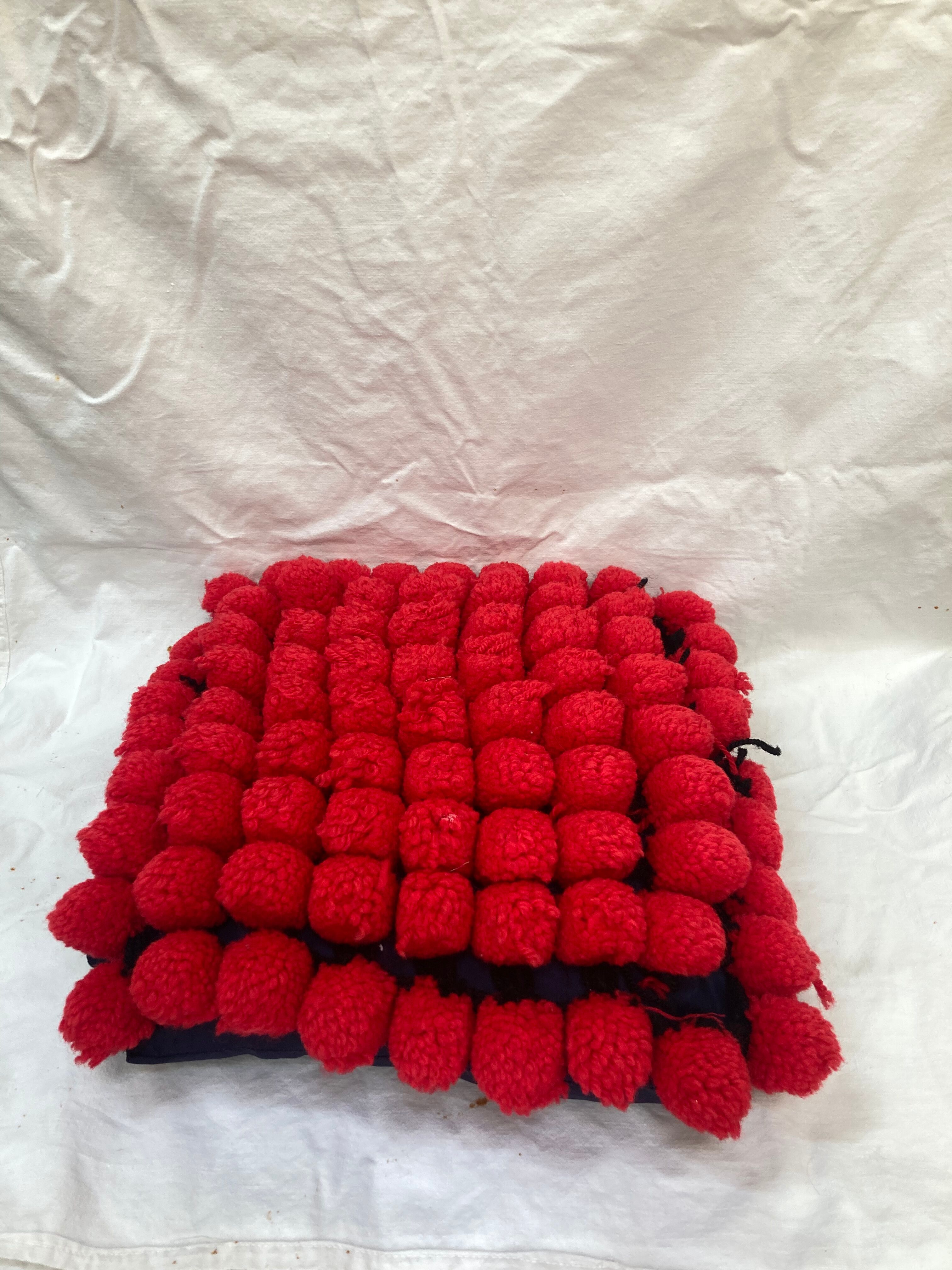 Vintage cushion red pompoms