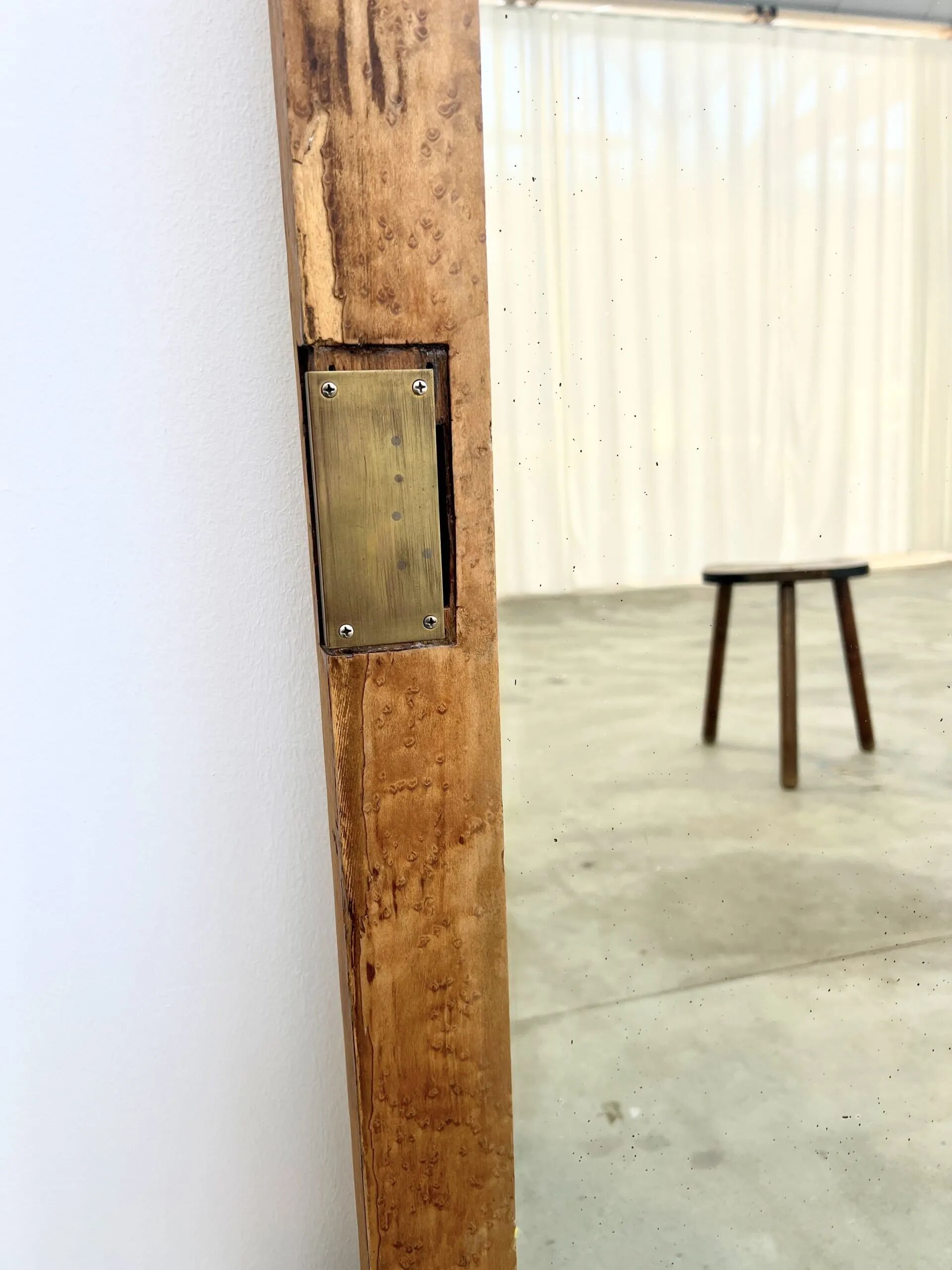 Antique mirror on an elm wardrobe door