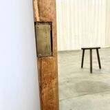 Antique mirror on an elm wardrobe door