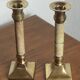 Pair of brass and stone candlesticks
