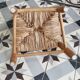 Antique wooden child's chair with a straw seat.