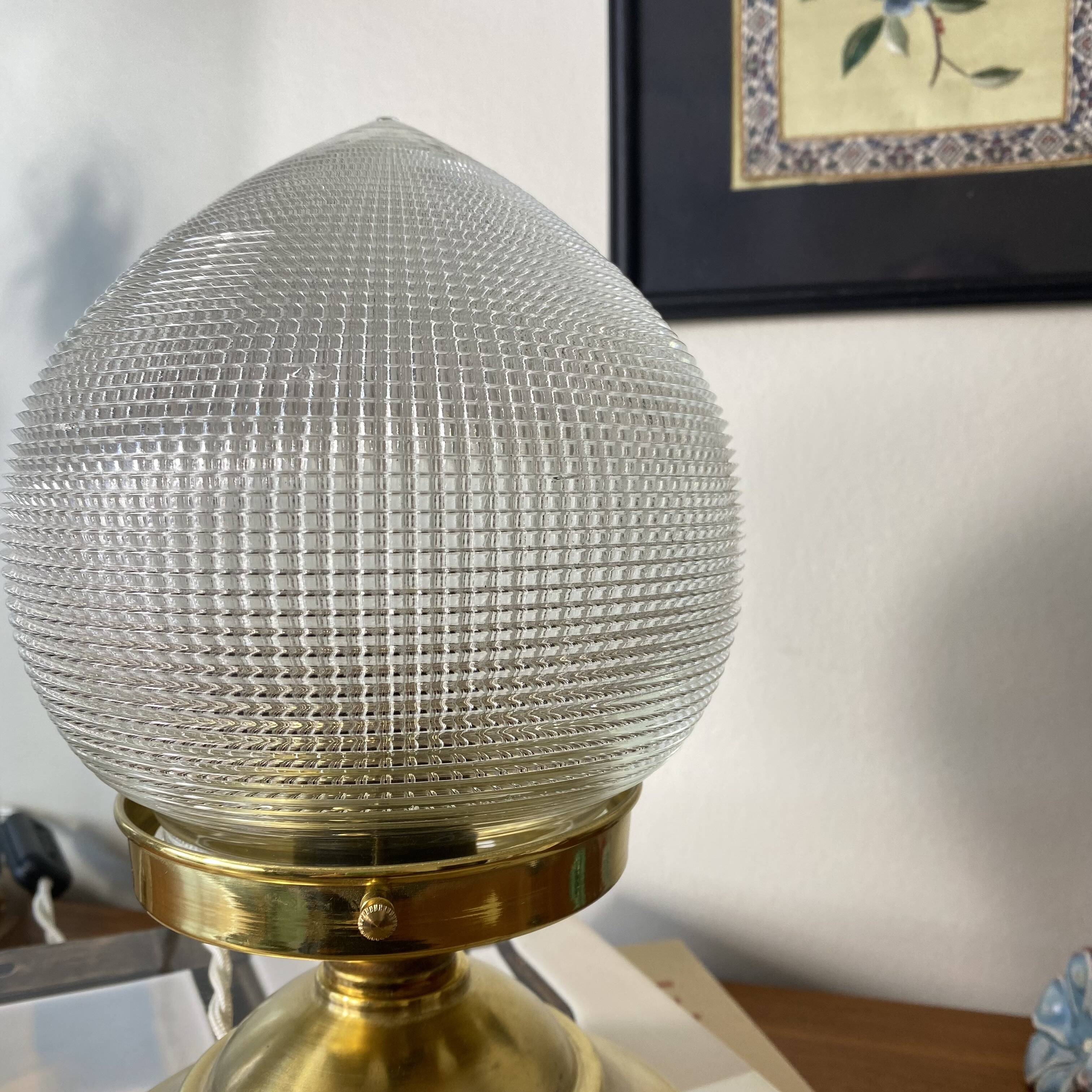 Antique globe table lamp in glass, Holophane type, and brass.