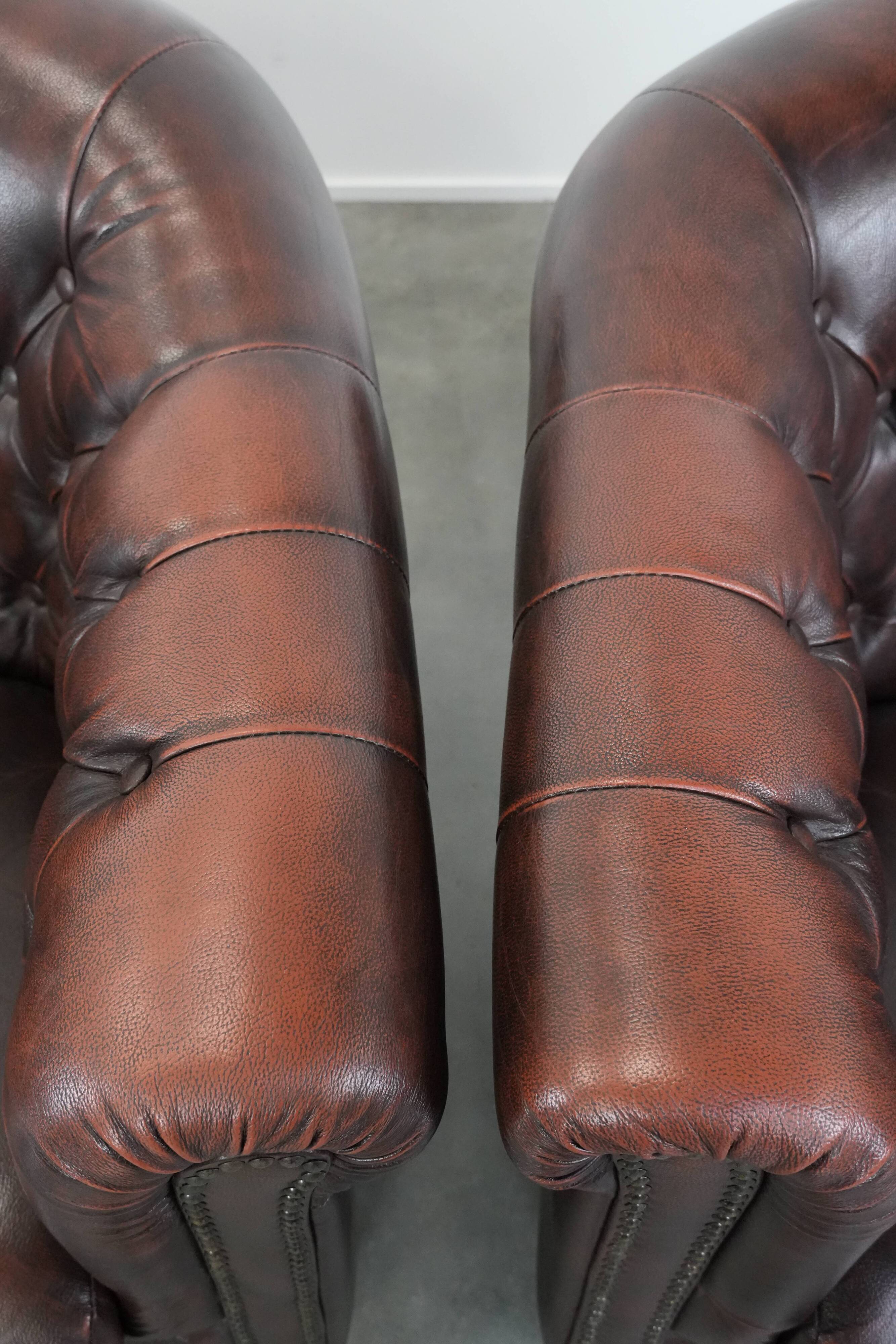 Set of three classic English-style Chesterfield cowhide  club armchairs