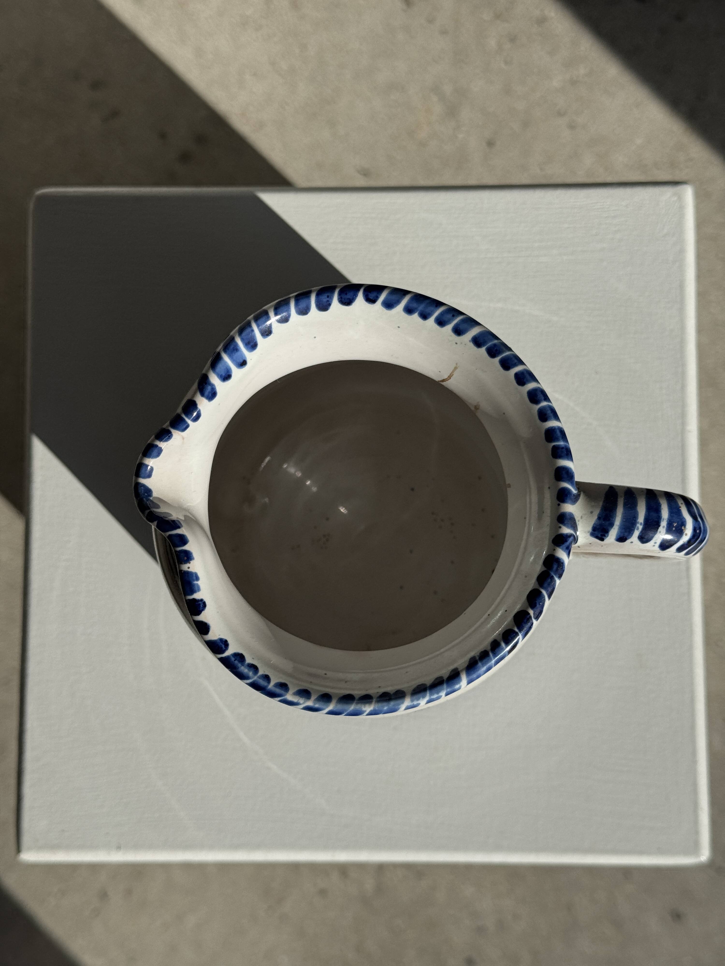Artisan blue floral decorative carafe, height 17 cm, diameter 24.5 cm.