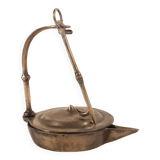 Old oil lamp in golden brass to hang