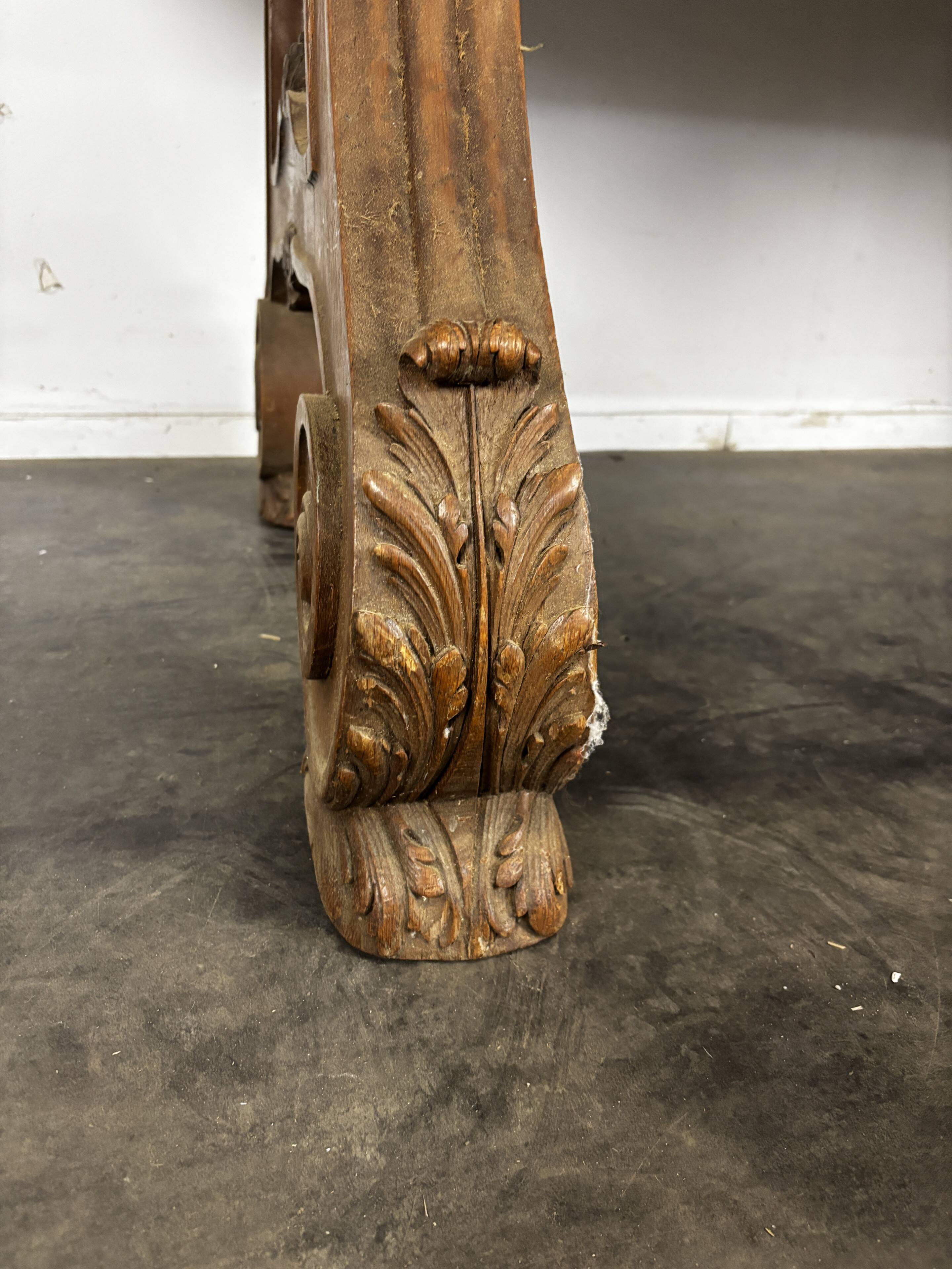 Renaissance-style oak dining table with lyre legs.