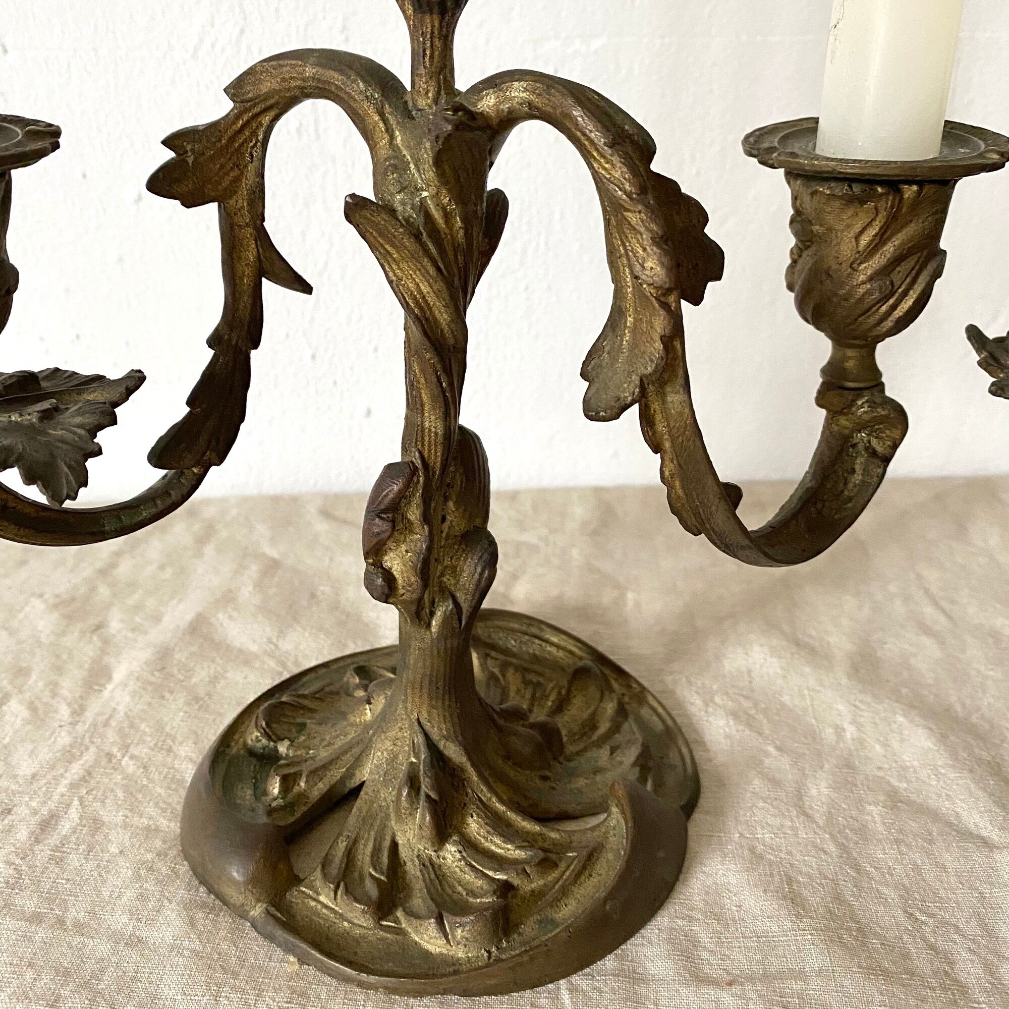 Pair of antique bronze candlesticks at the end of the table XIXth