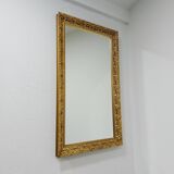 Grand miroir mural vintage sculpté et doré 1970