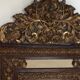 Miroir parecloses bois et métal repoussé