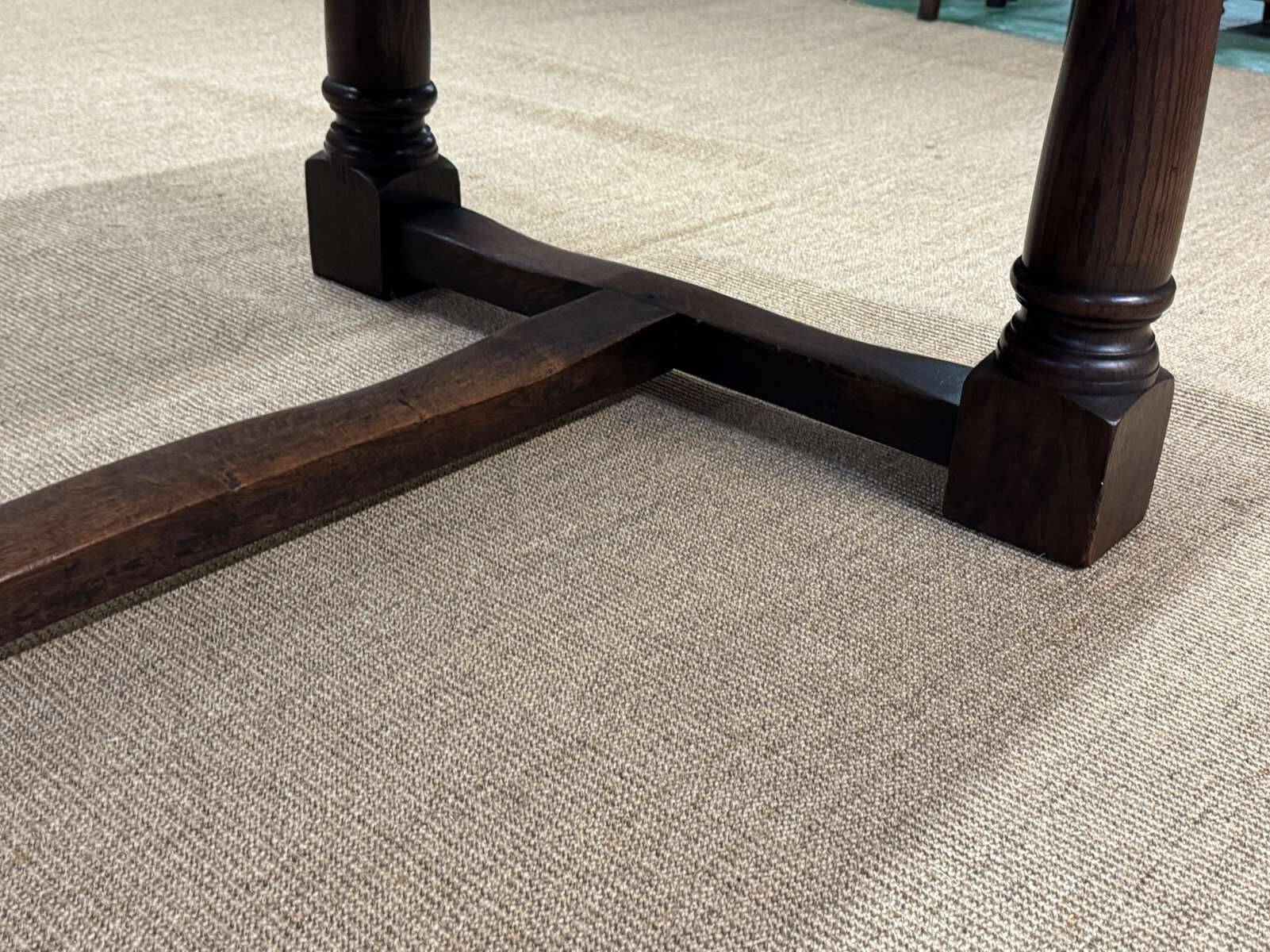 English monastery table with extensions from the late 19th century in elm and oak.
