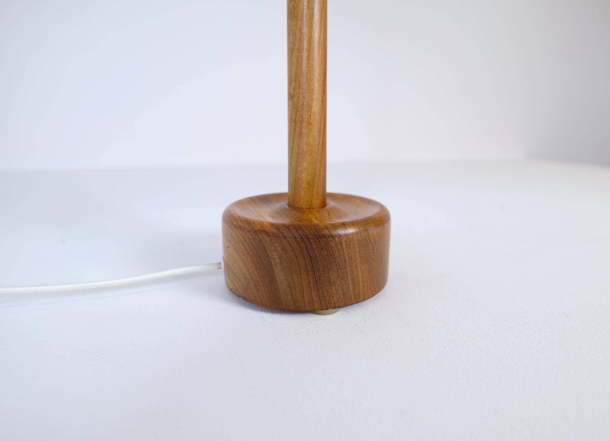 Mid-century solid teak table lamp from the 1960s Sweden.