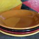 Four multicolored soup plates from the 1950s