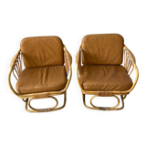 Pair of leather and bamboo armchairs
