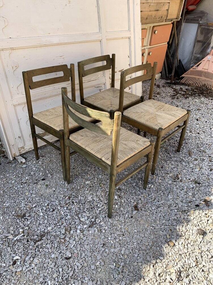 Set of 4 brown wooden dining chairs with straw seats, 1970s.