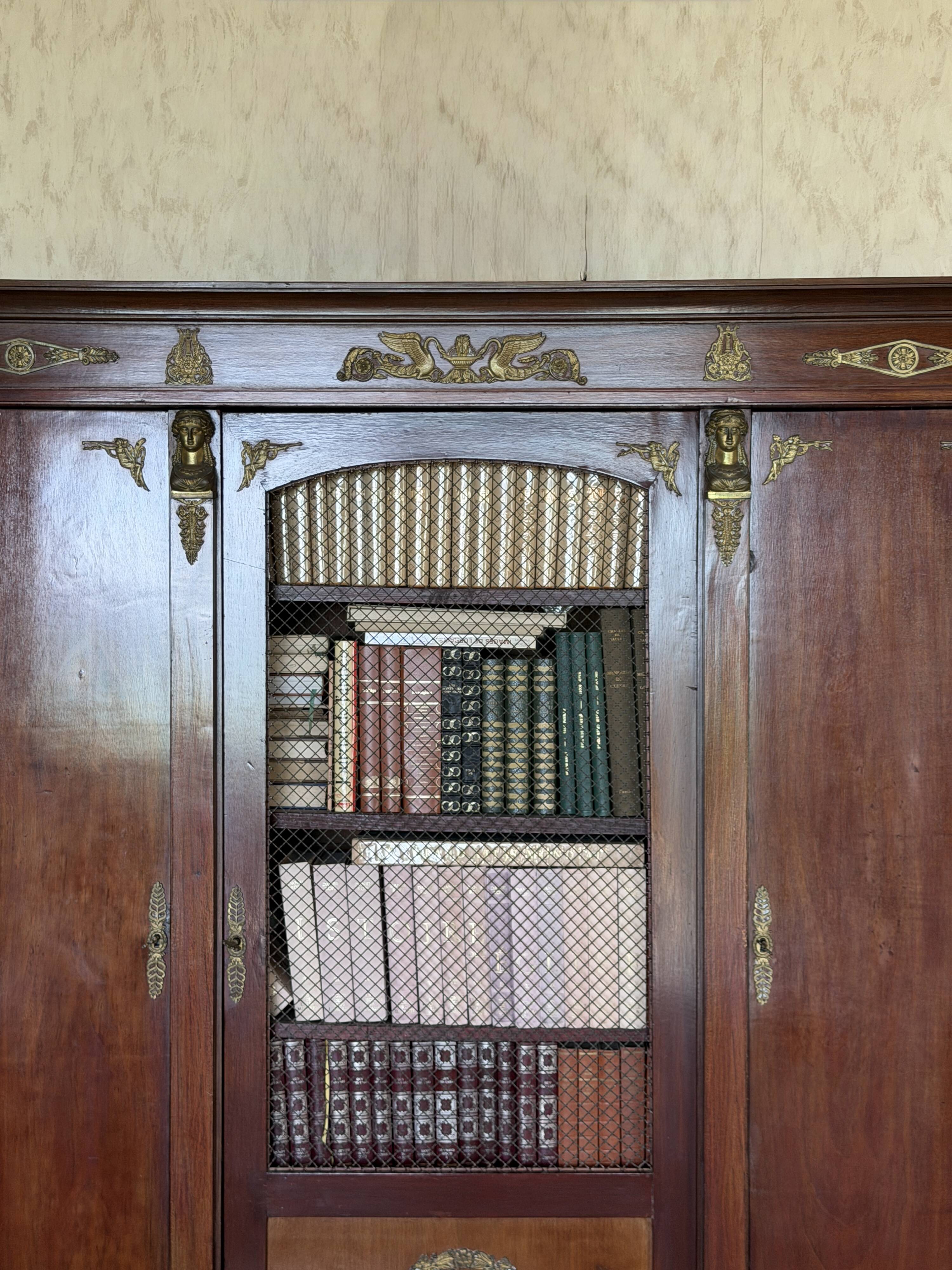 Large antique library from the Empire/Napoleon III period in mahogany and gilded bronze.