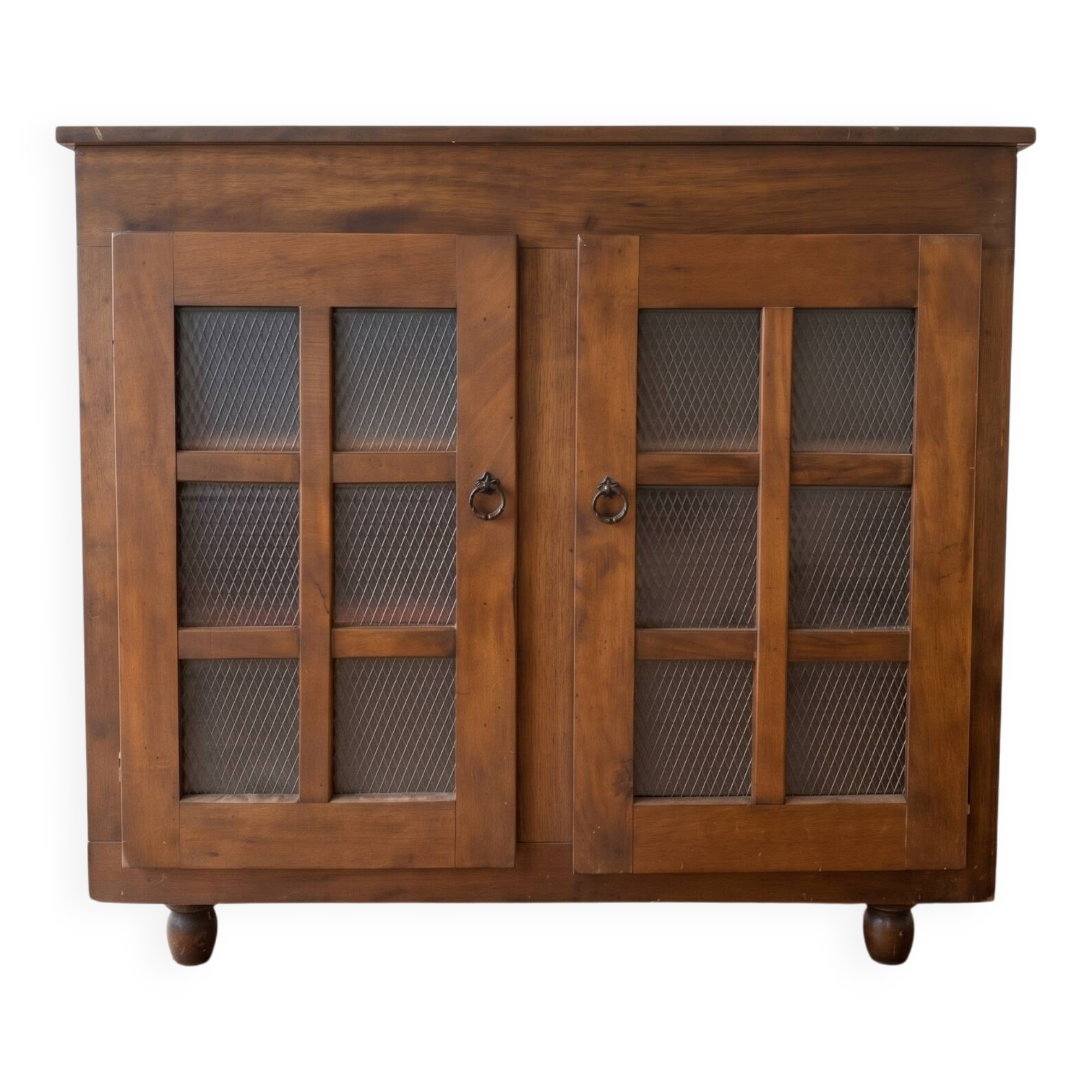 Small antique wooden sideboard with glass doors.