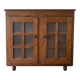 Small antique wooden sideboard with glass doors.