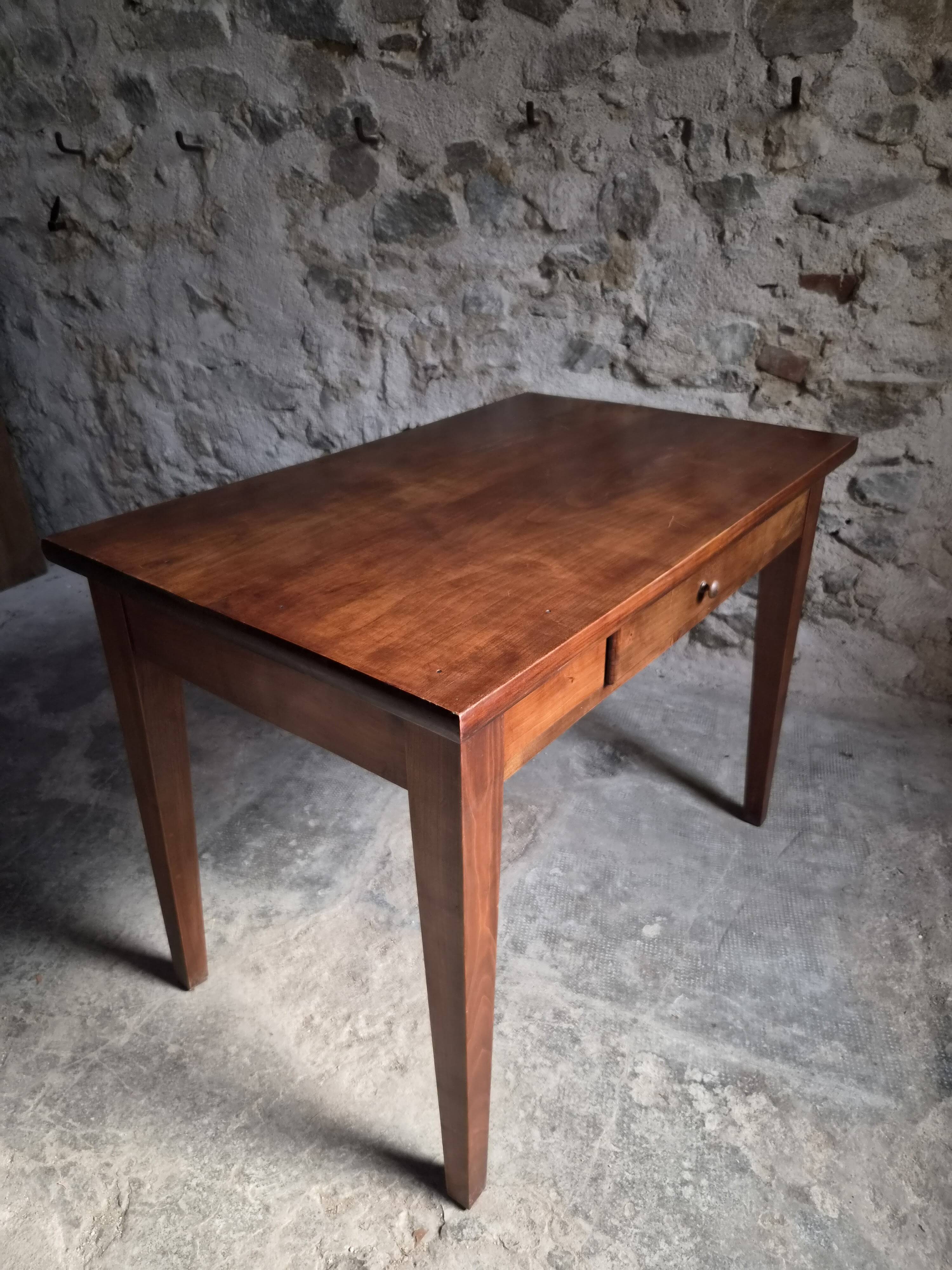 Old French table in cherry wood with bistro chair, circa 1900–1930.