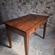 Old French table in cherry wood with bistro chair, circa 1900–1930.