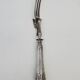 Set of serving forks and silver-plated leg of lamb fork.