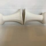Pair of white candlesticks with faceted tulip foot