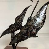 Small metal and wood fish statue