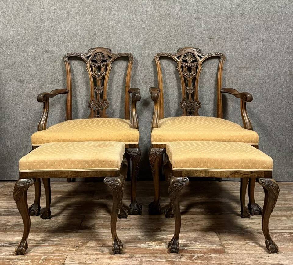 Pair of English armchairs with mahogany footrests circa 1850