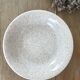 Beige speckled hollow plates