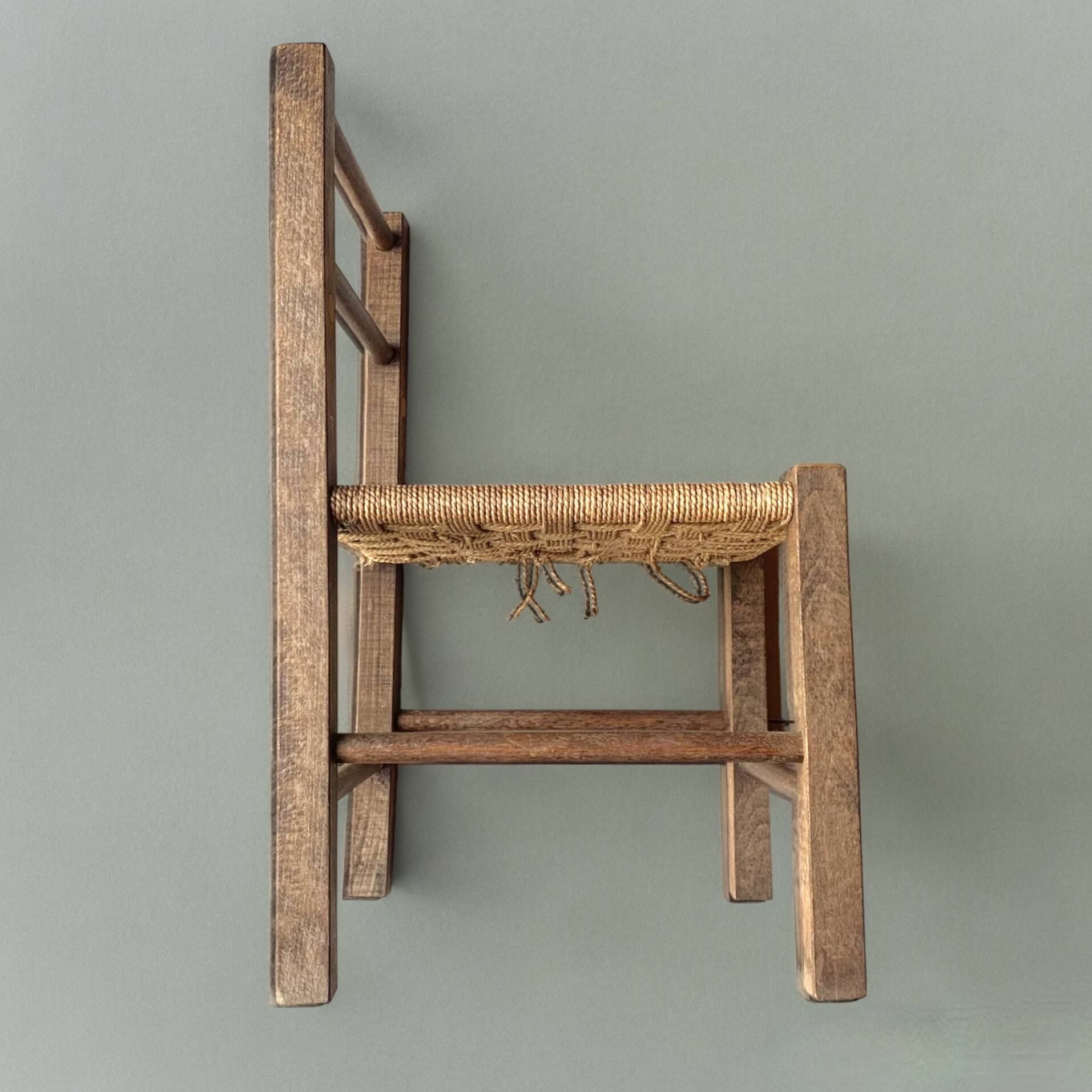 Vintage children's chair made of rope and wood