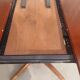 round/oval table with extension, central leg, dark shade, Baumann design