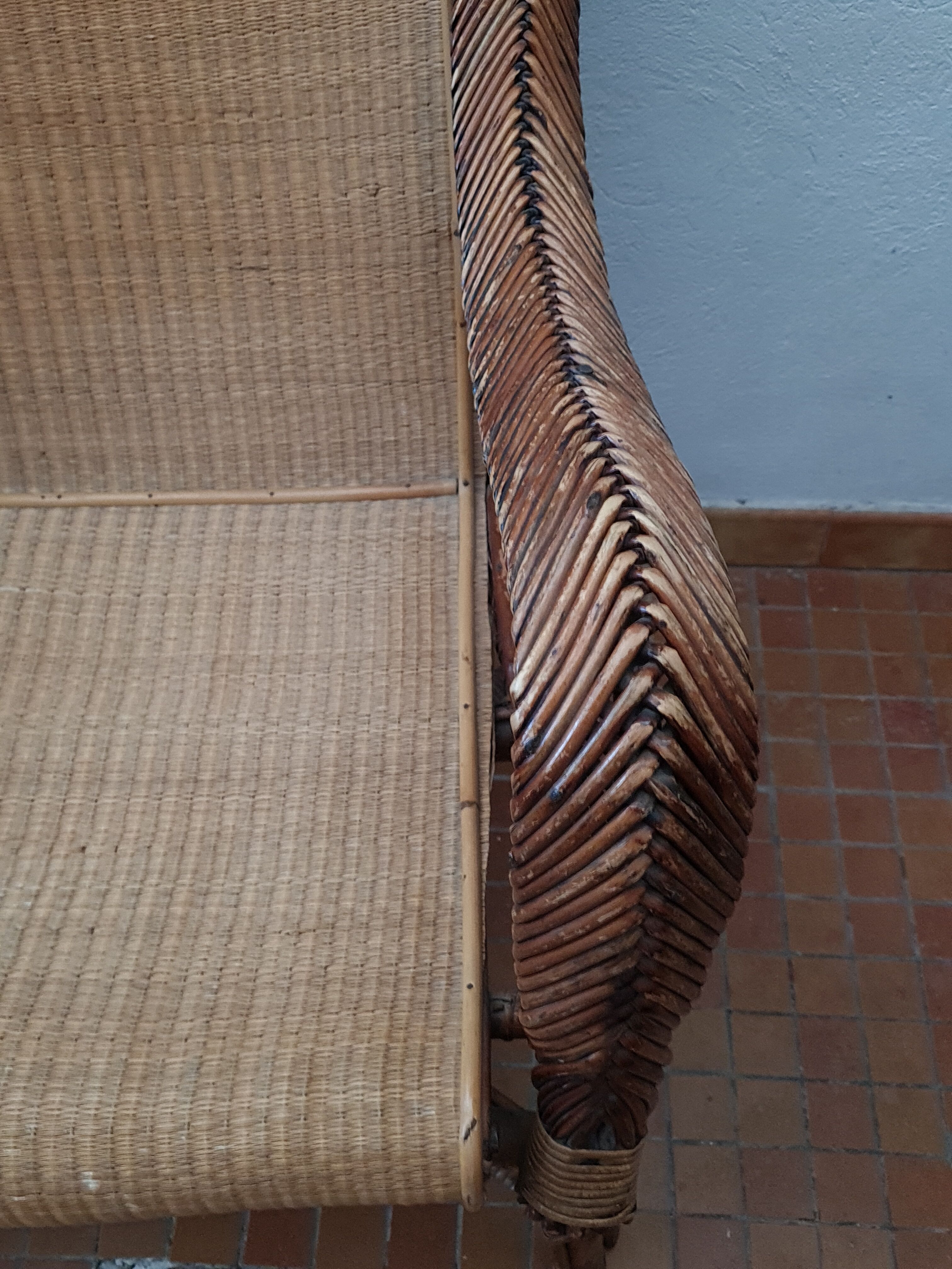 Old rattan armchair circa 1900-1930