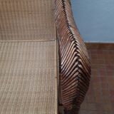 Old rattan armchair circa 1900-1930