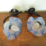 Wall sconces with opalines in the shape of corollas and black metal support