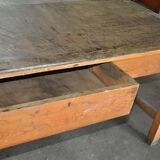 Large industrial workshop table in brown wood, wide top and sturdy vintage legs.