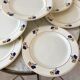 Lot de 7 assiettes plates Terre de Fer modèle "Romeo" début XXème
