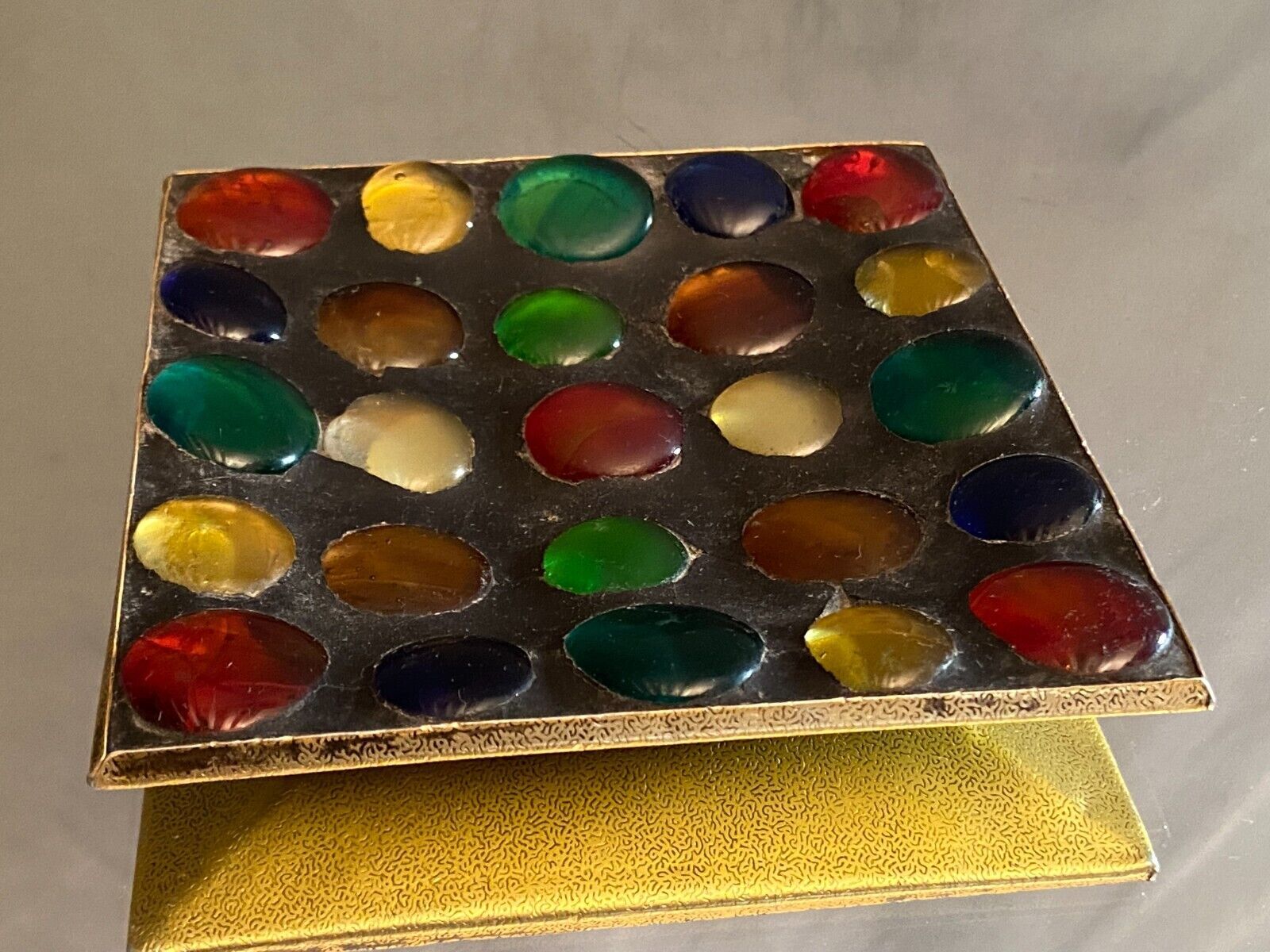 Square section cut glass and metal decorated with multicolored glass cabochons