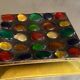 Square section cut glass and metal decorated with multicolored glass cabochons