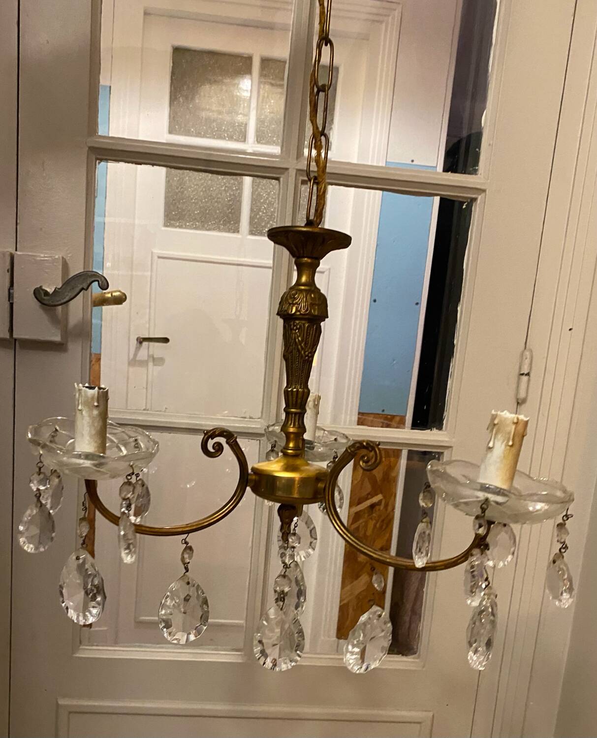 Golden brass chandelier and glass