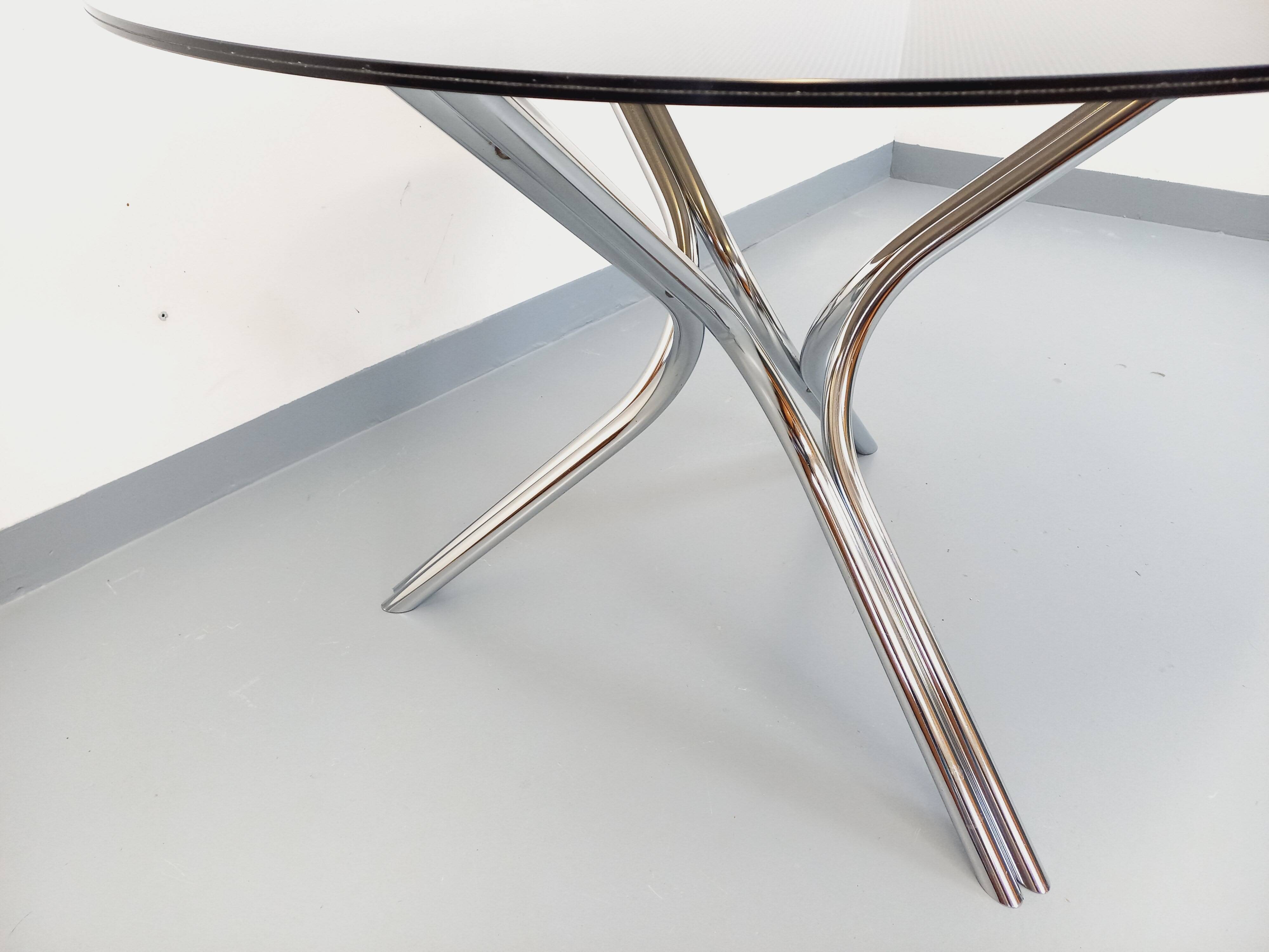 Vintage dining table in smoked glass plexiglass and chrome metal.