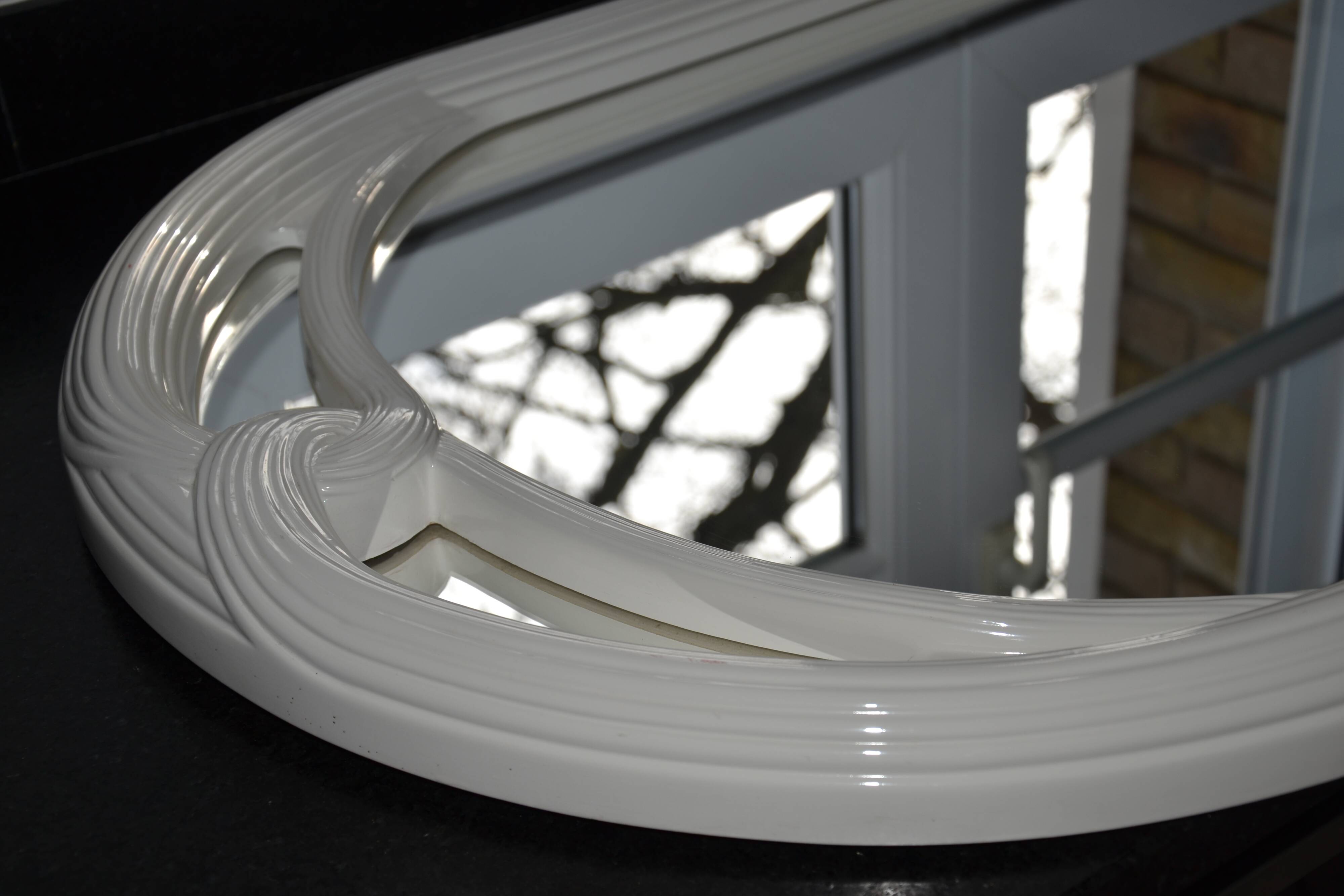 White mirror in 90s Art Deco style