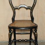 Four antique Regency bergère chairs with mother-of-pearl inlay.