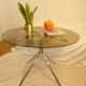 Table vintage 70 en verre légèrement fumé pieds chromés