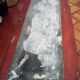White veined black marble fireplace