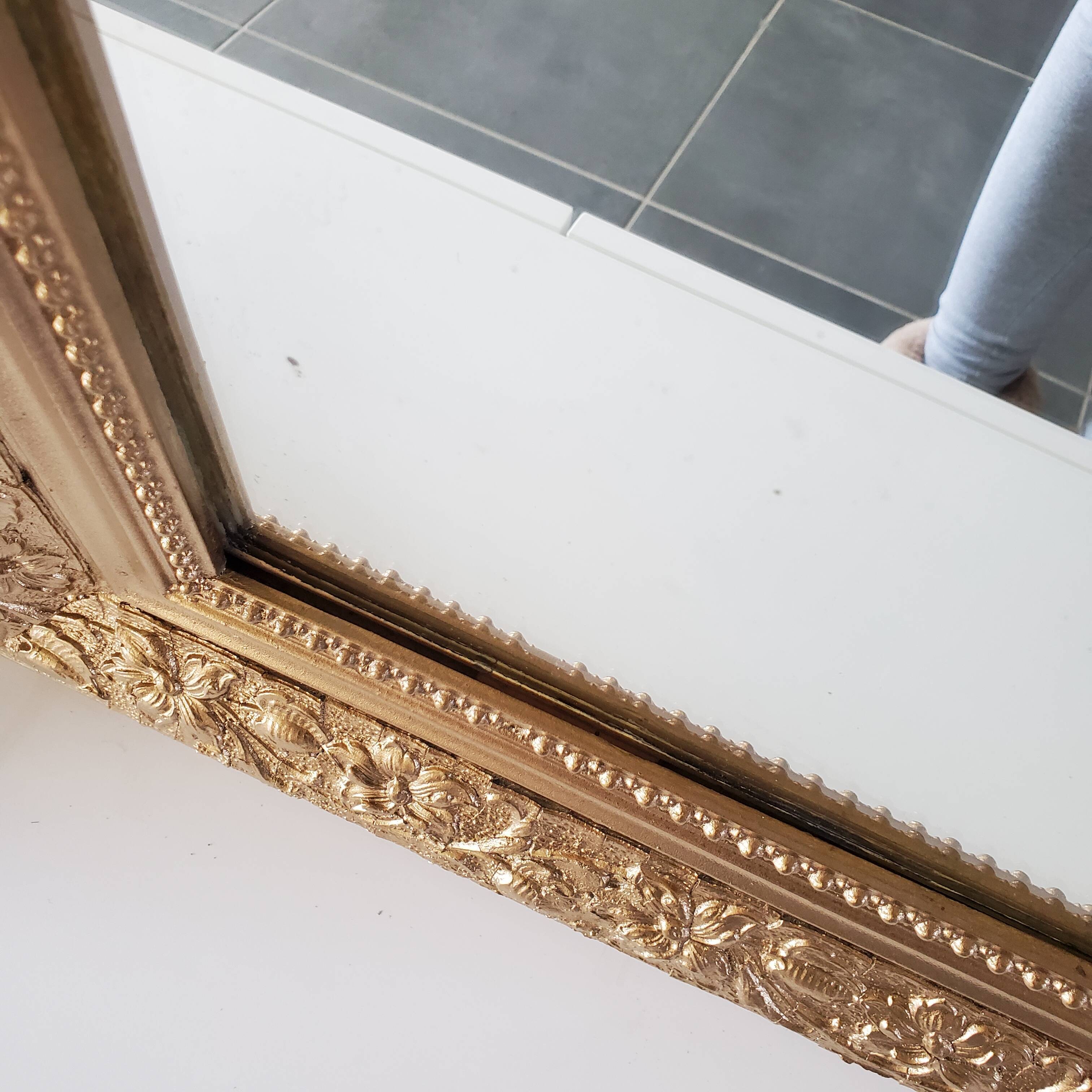 Antique mirror with gilded wood crests