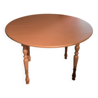 Round wooden table with folding sides