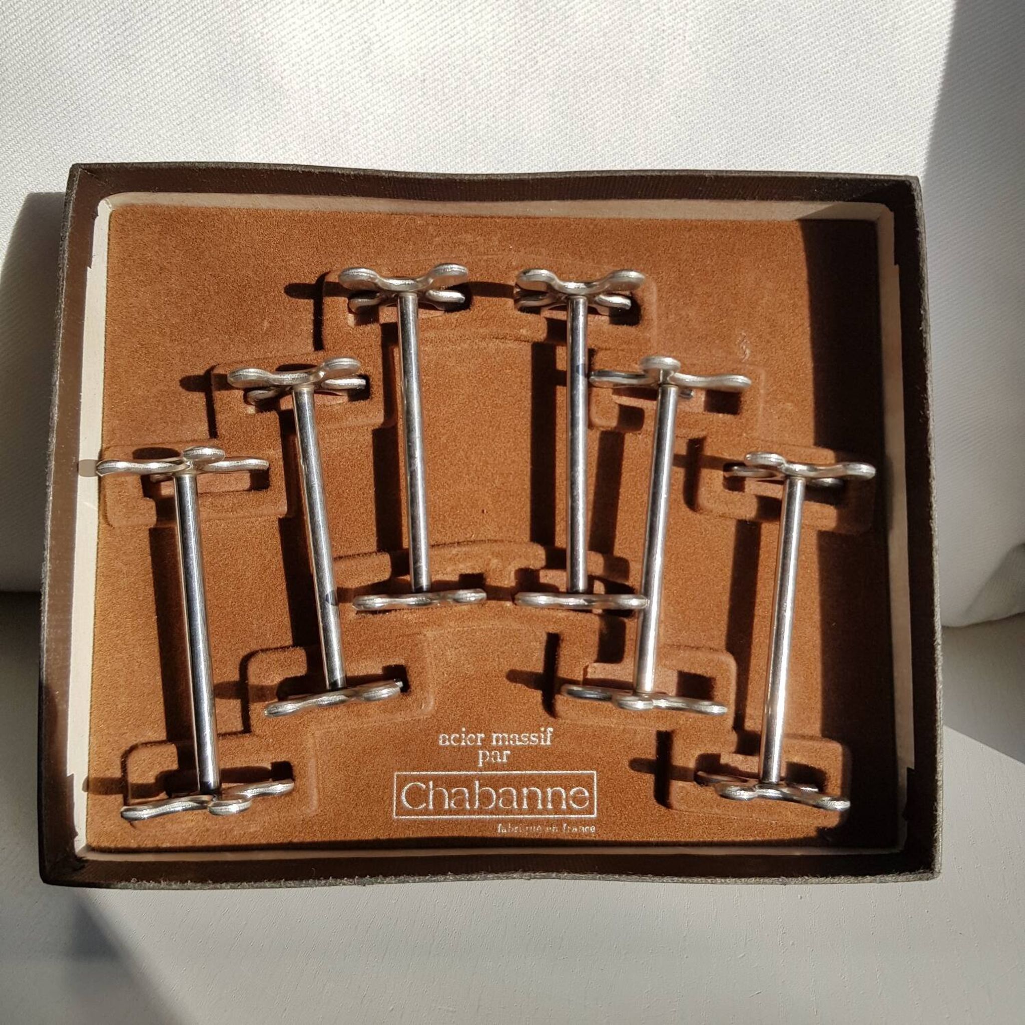 Set of 6 stainless steel knife rests by Chabanne in its original box.