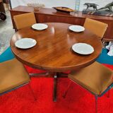 Baumann style round table with integrated extensions from the 70s