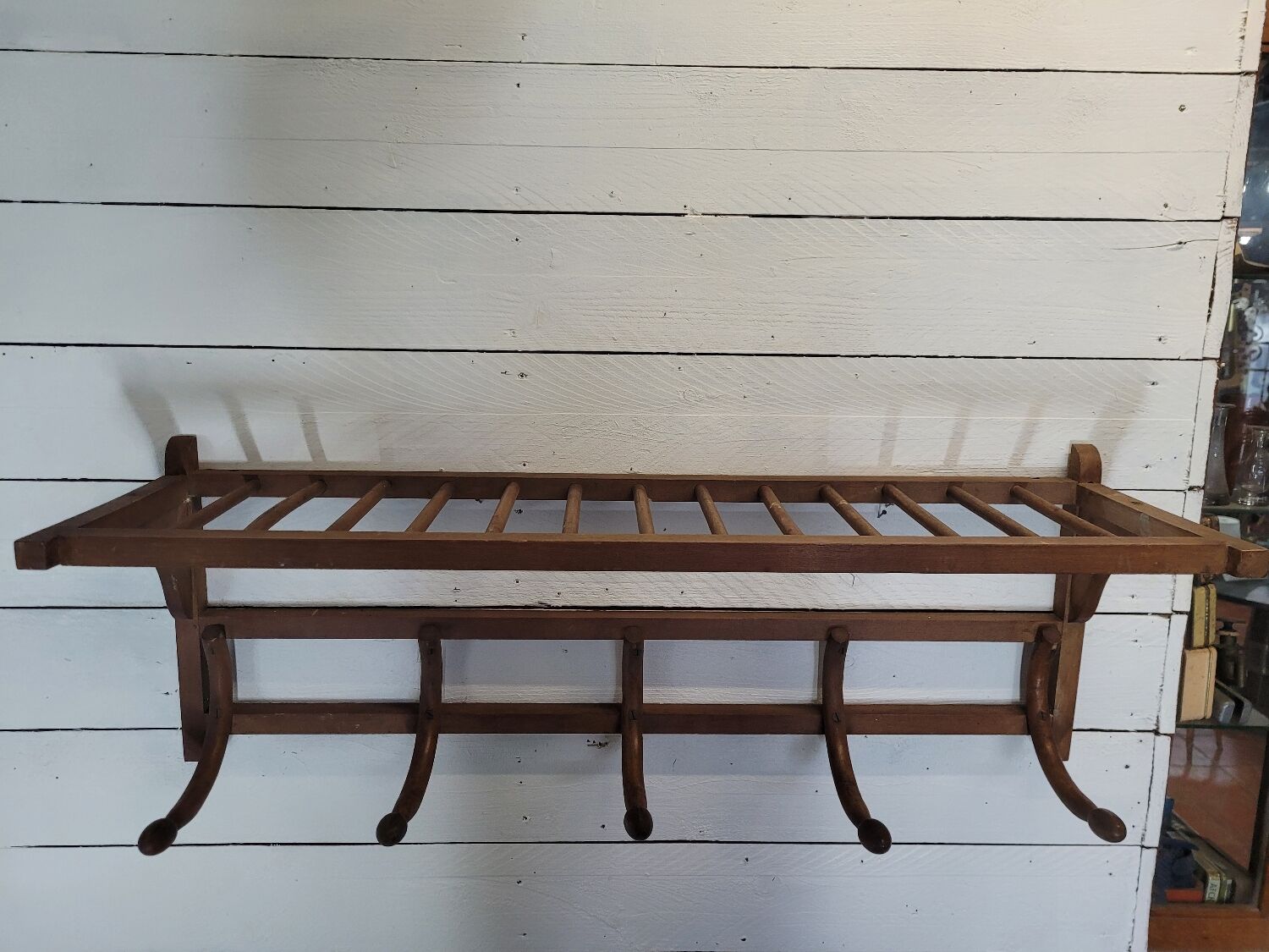 Curved wooden coat rack