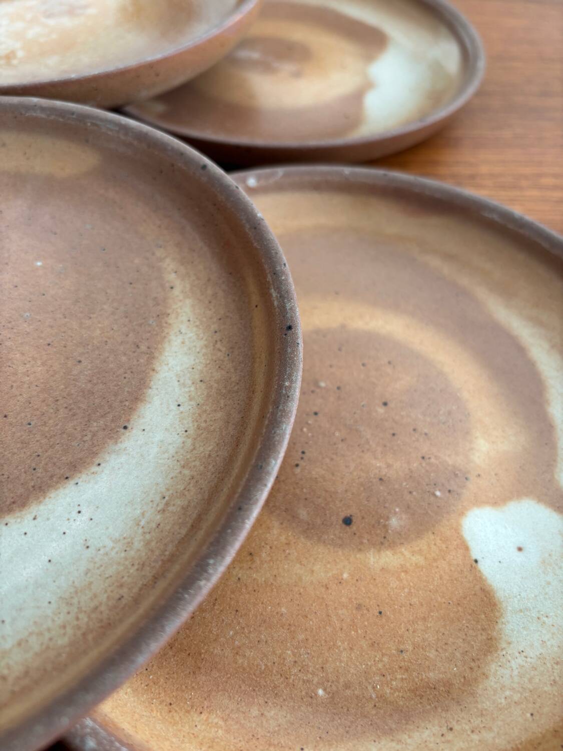 Lot of vintage 1970s beige stoneware dessert plates, handmade.