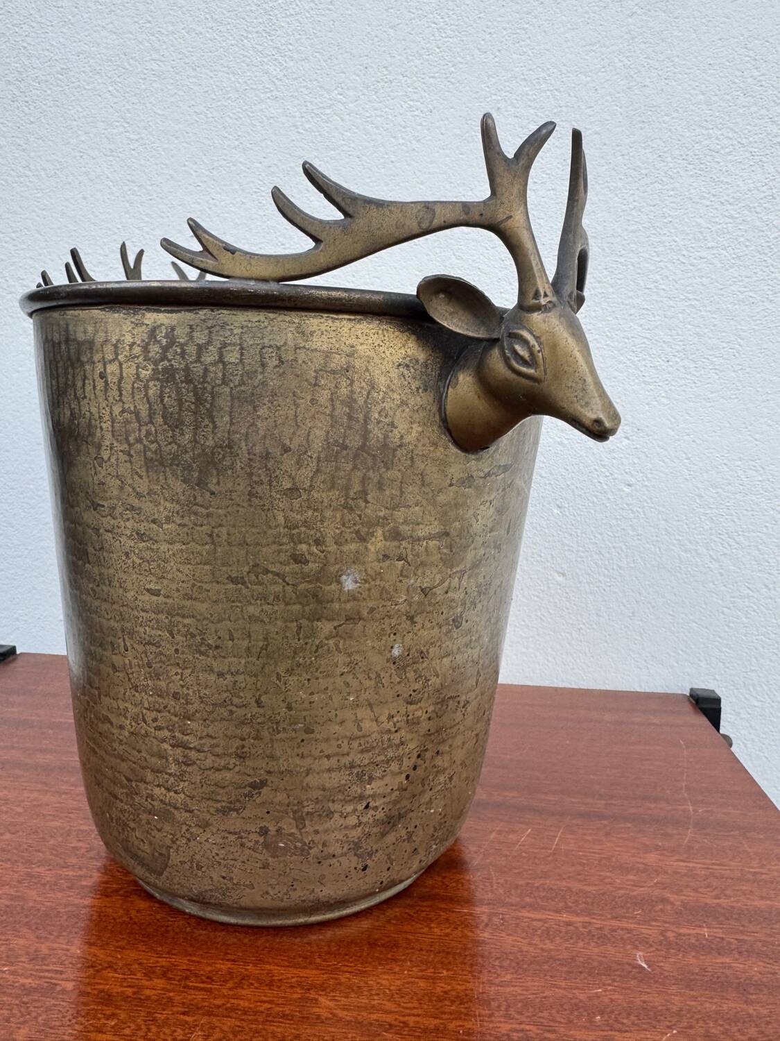 Antique champagne cooler with stag heads